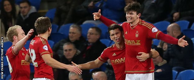 Oliver Burke celebrates with his Nottingham Forest after scoring the opening goal