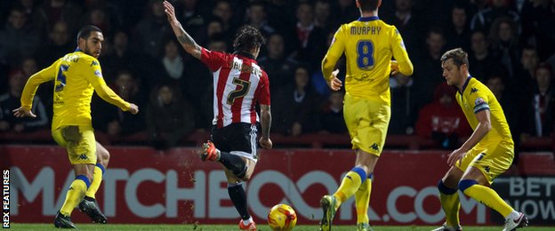 Sam Saunders shoots Brentford in to the lead against Leeds at Griffin Park