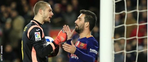 Pau Lopez and Arda Turan