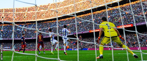 Barcelona forward Luis Suarez scores against Real Sociedad