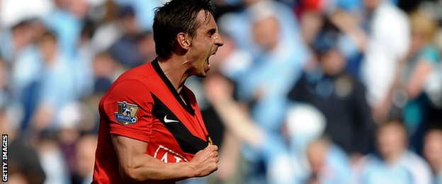 Gary Neville playing for Manchester United against Manchester City in 2010