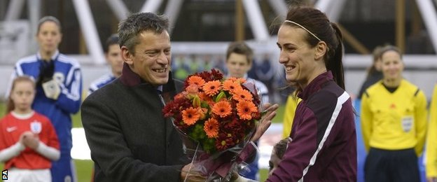 Jill Scott receives an award for 100 caps