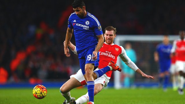 Arsenal's Per Mertesacker tackles Chelsea's Diego Costa