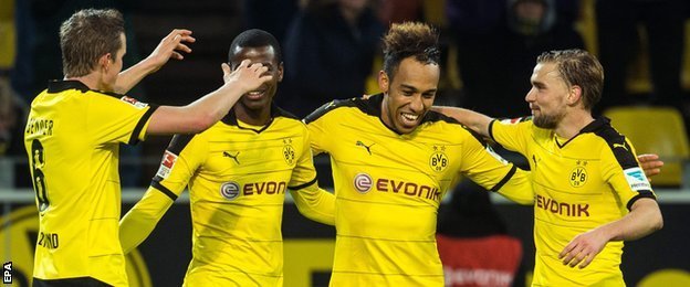 Borussia Dortmund players celebrate a goal against Stuttgart