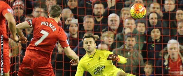 James Milner puts his penalty past Lukasz Fabianski